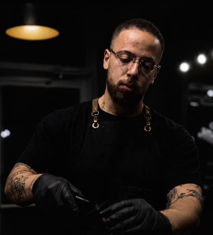 Badawi, founder and lead barber, at work in the studio